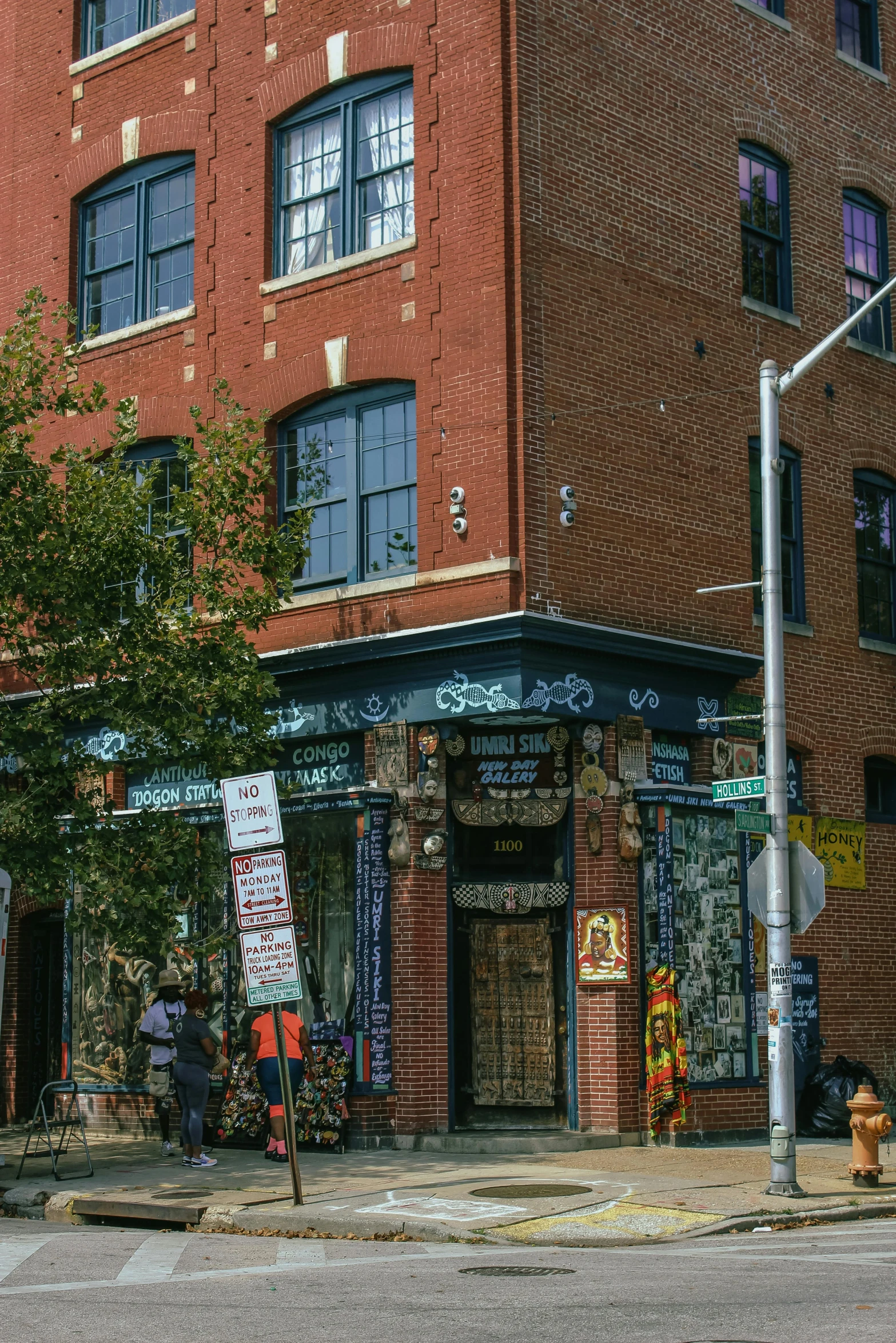 people sitting at tables outside a building