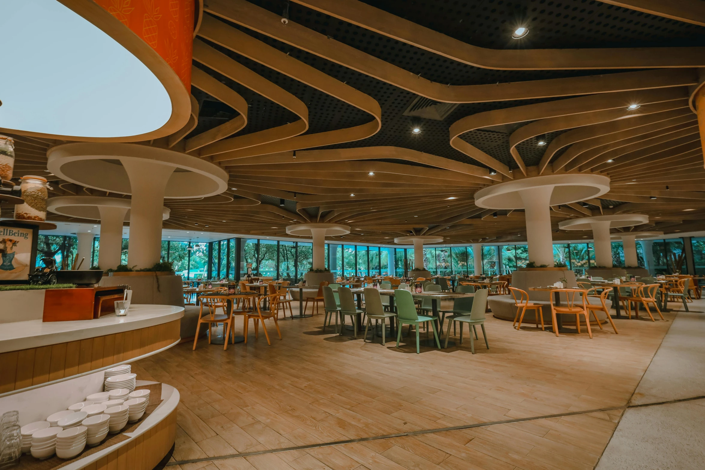 a large cafeteria with many tables and chairs