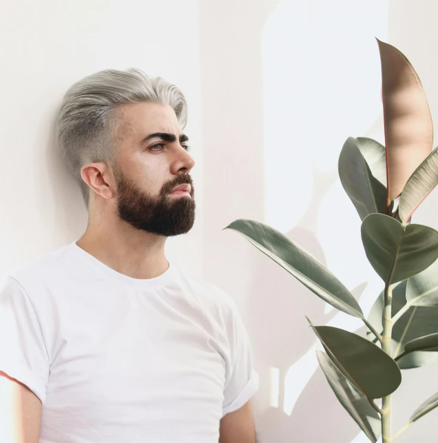 a man with grey hair looking off into the distance