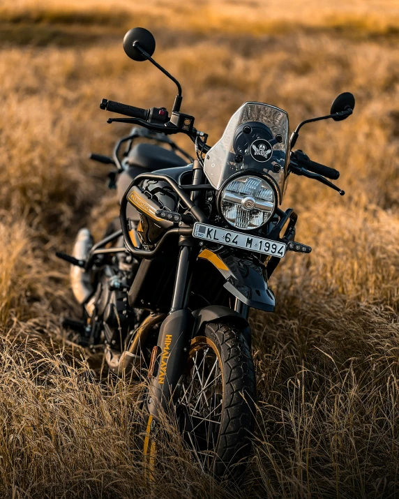 two motorcycles parked in the middle of a field