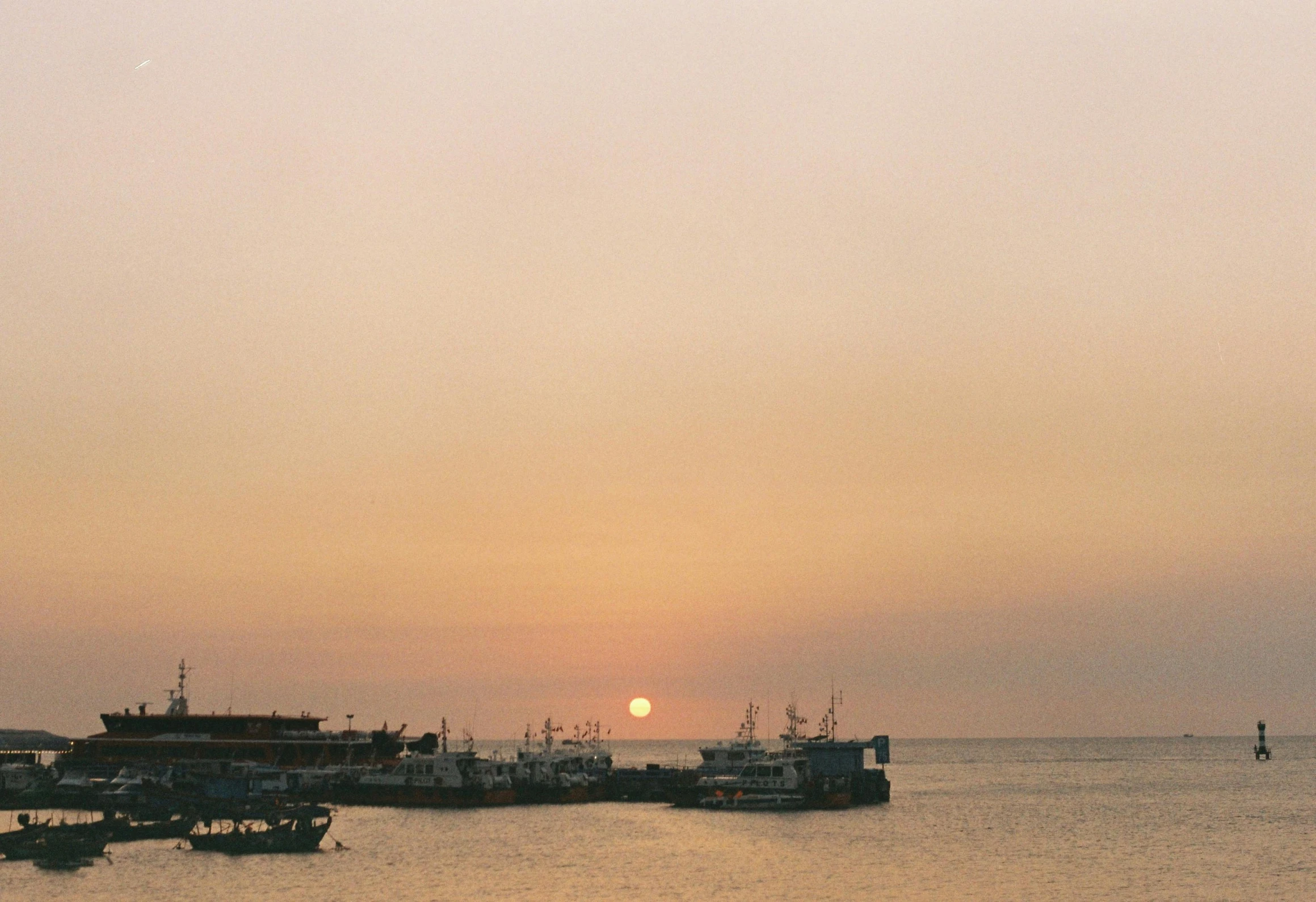 a number of boats on a large body of water