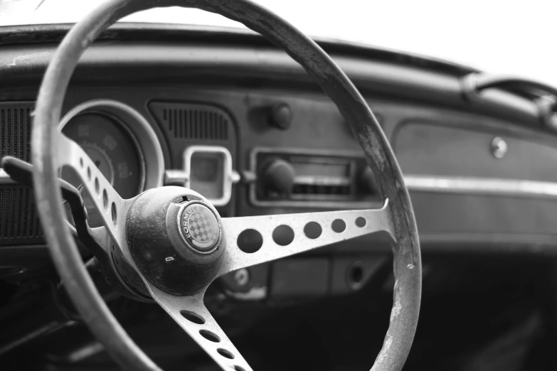 the interior of a car with the steering wheel turned up