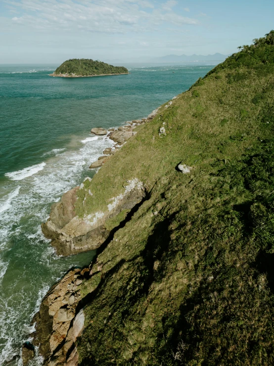 a long road along a cliff near the ocean