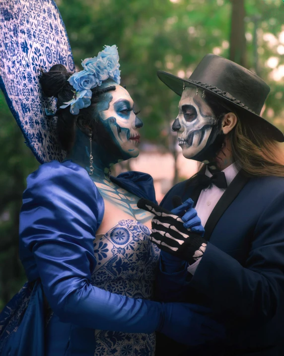 two people are dressed up in makeup and costumes