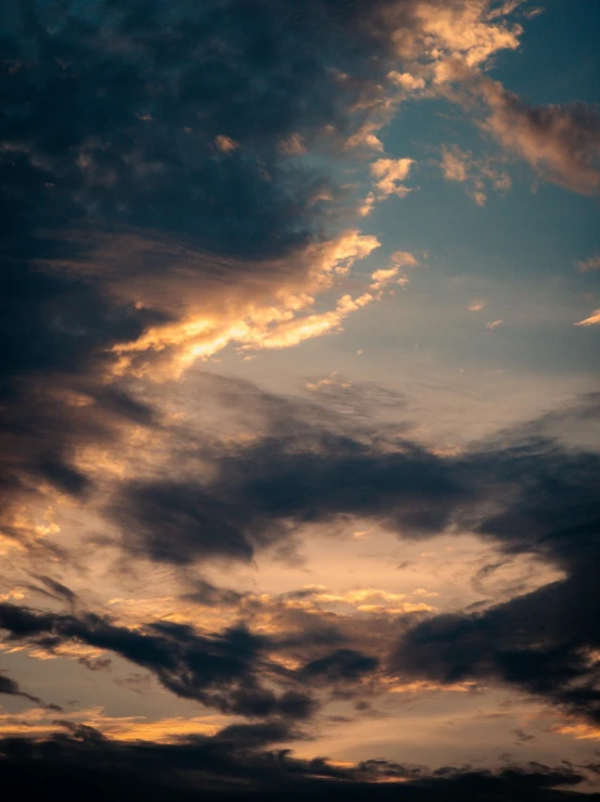 an image of a sky setting in the middle of the day