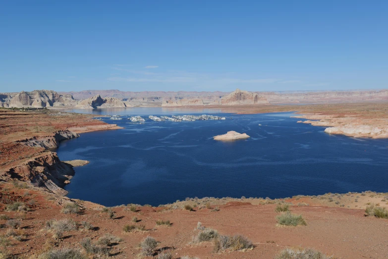 a body of water surrounded by rocky terrain