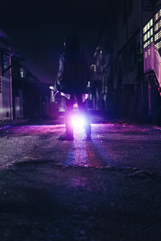 a bike rider rides through the dark streets