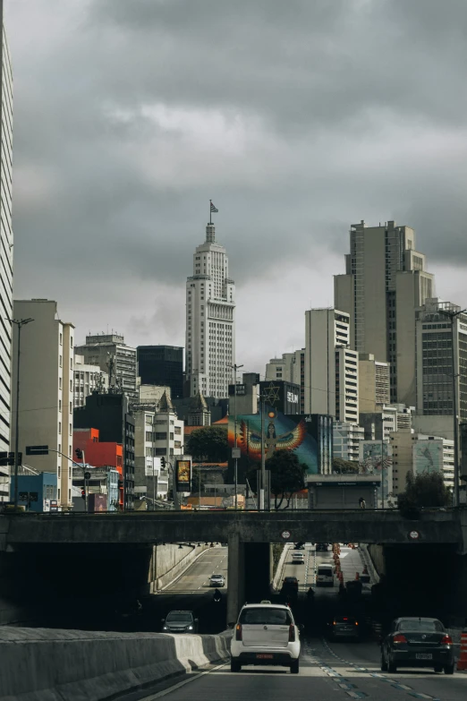 the skyline is covered by many skyscrs and traffic