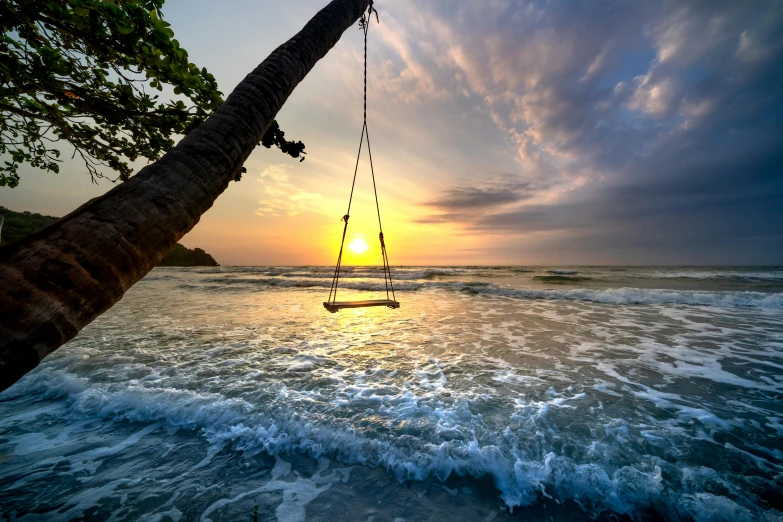 a boat floating in the ocean near the beach