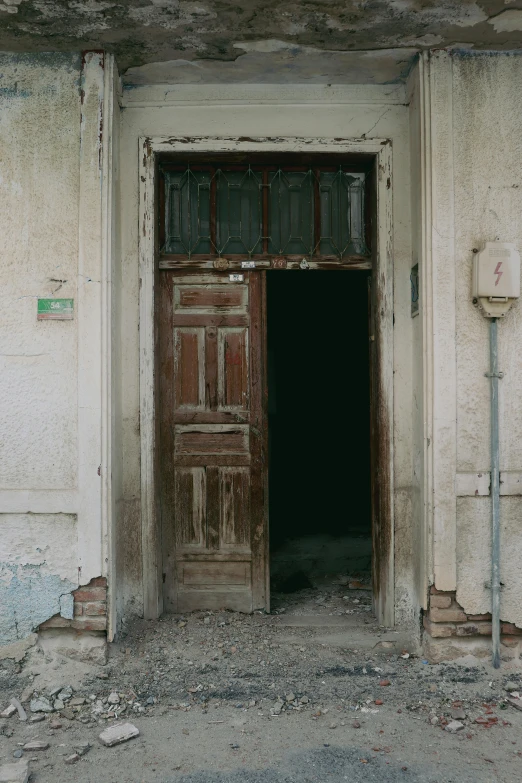 an open doorway and windows in an old building