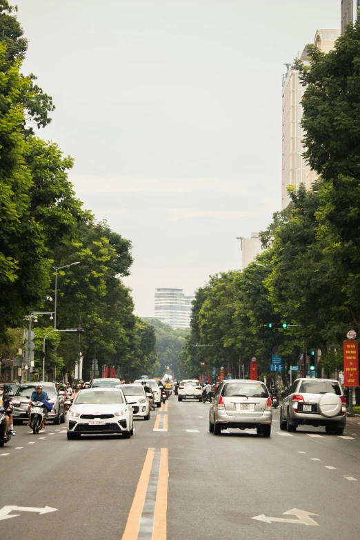 a group of vehicles that are driving on the street