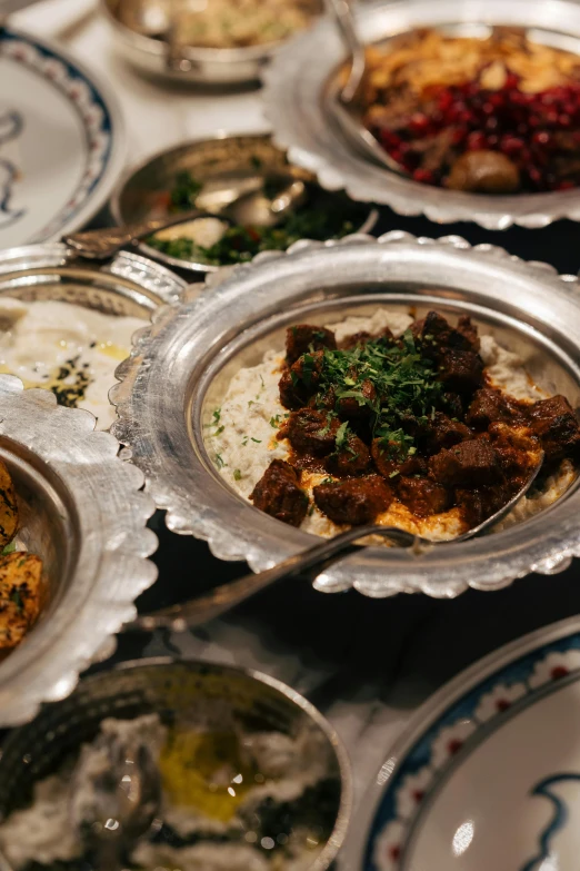 dishes of food including meat, rice and vegetables