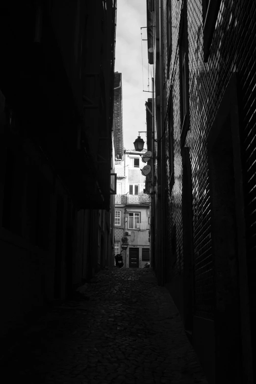 a long narrow alley in an old city