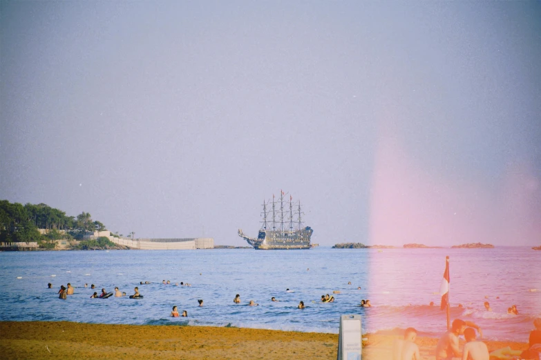 two pos, one of people in the water and one of people swimming in the ocean