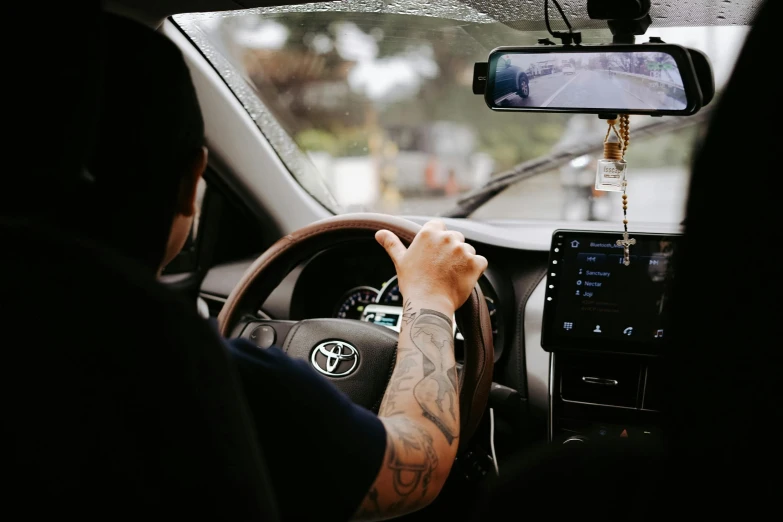 a man driving on his way to the beach