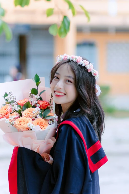 a young asian girl holding some flowers