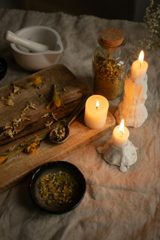 some candles on a table next to other items