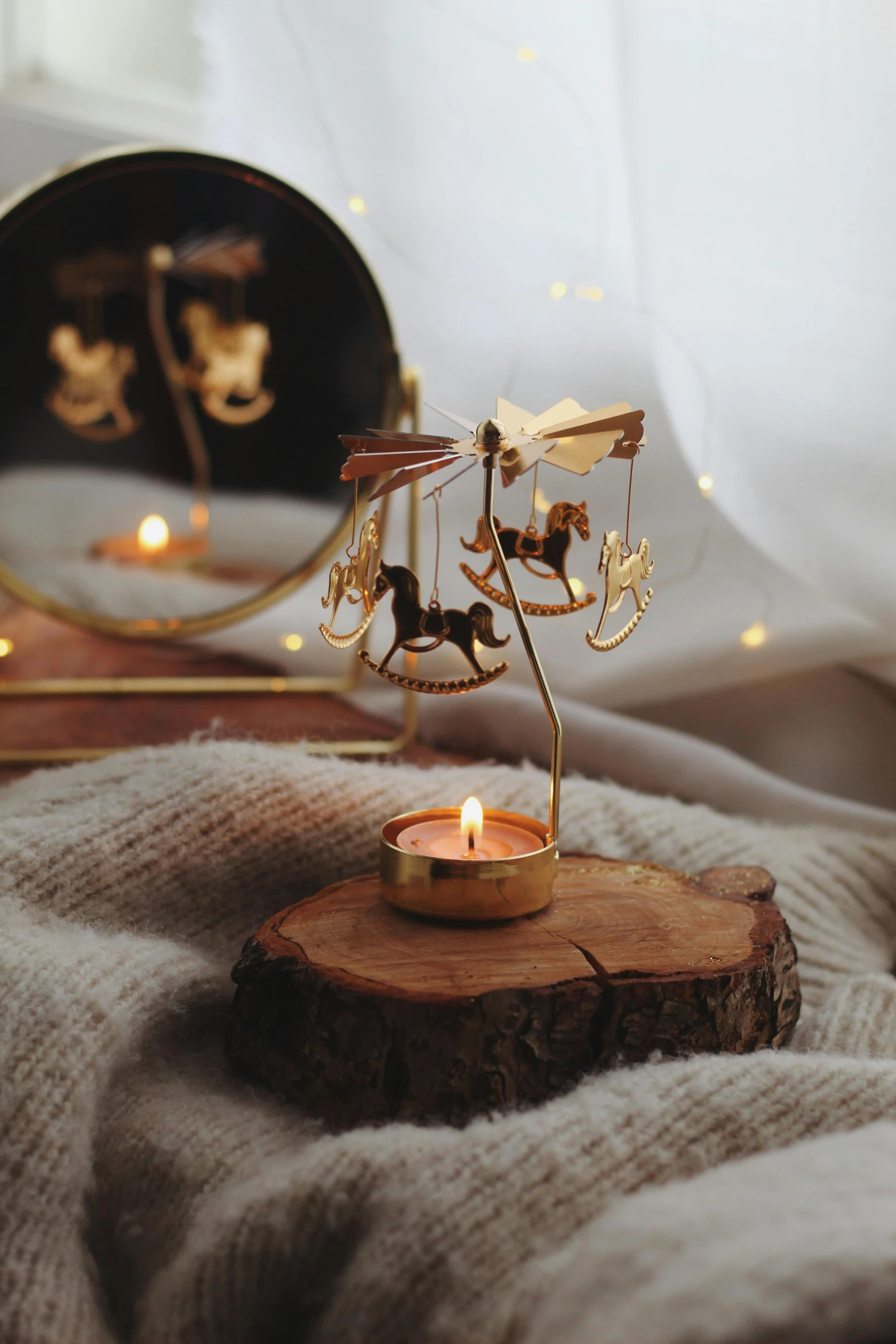 a candle that is sitting on top of a wooden stump