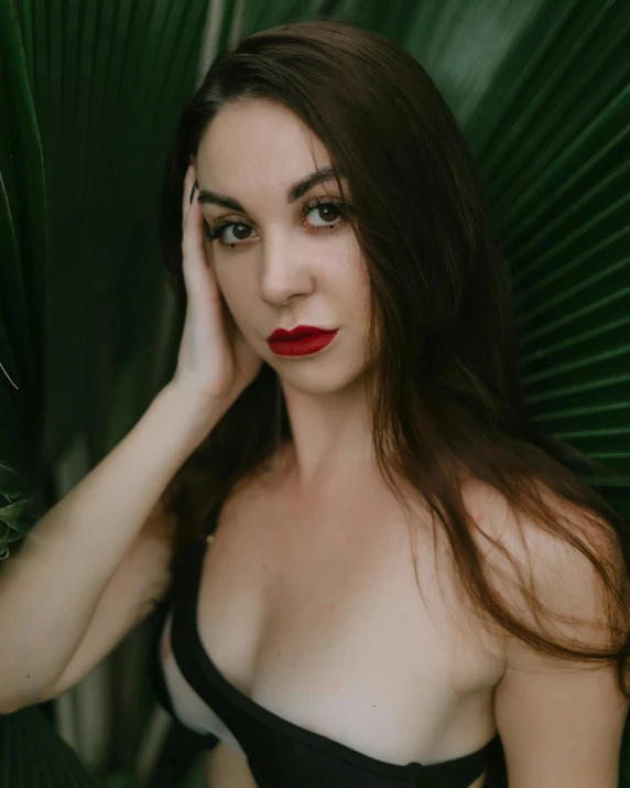 woman with red lipstick in black and white corset