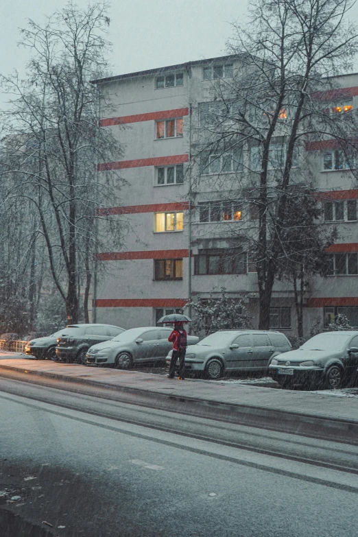 the cars are lined up on the street in front of the building