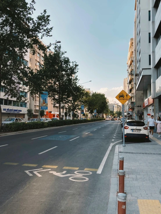 a street is shown with buildings and bicycles