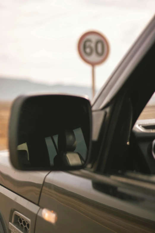 a close up of a truck in front of an 80 sign