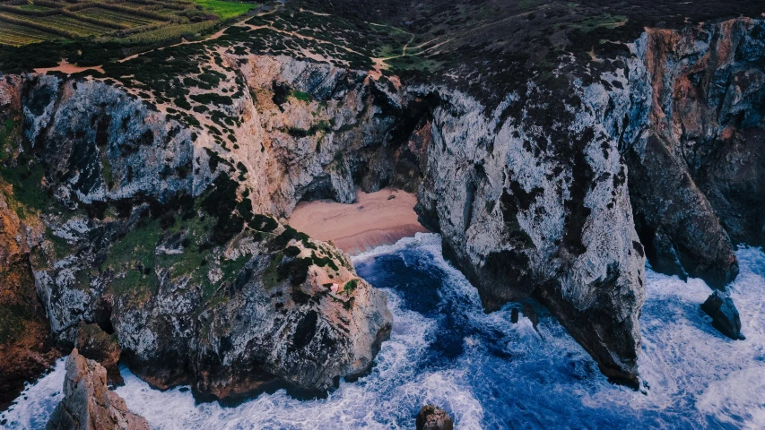 an aerial view of cliffs that are very rugged