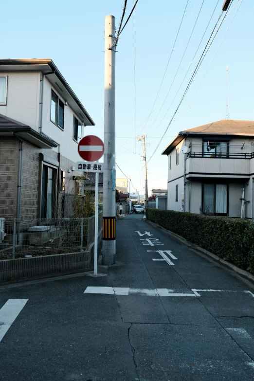 a view down an empty city street with telephone lines