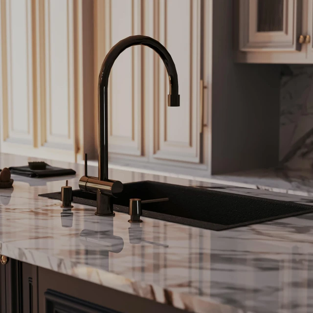 the kitchen has marble counter tops and modern faucet