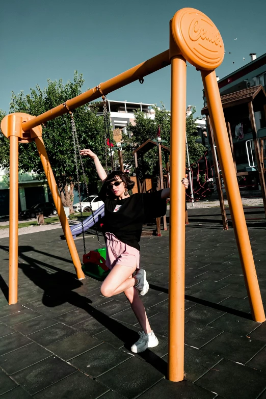 a woman standing on a wooden structure with a child