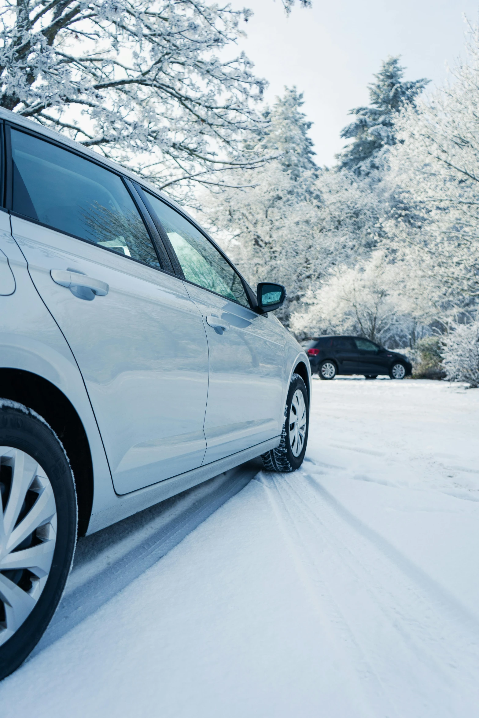 the rear view of a car in snow covered road