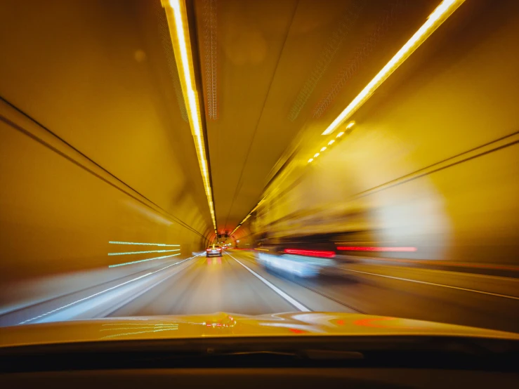 a car in motion going through a tunnel