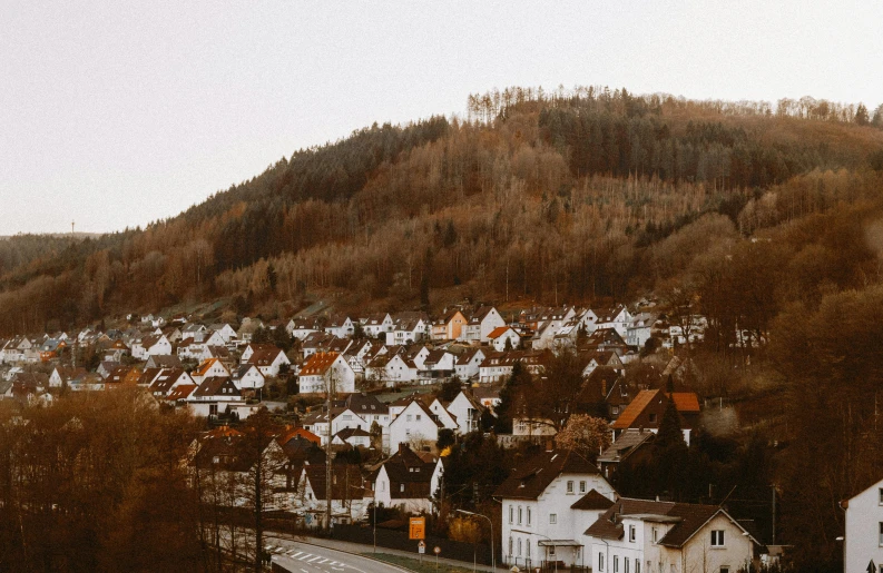 a village is nestled on a small hill