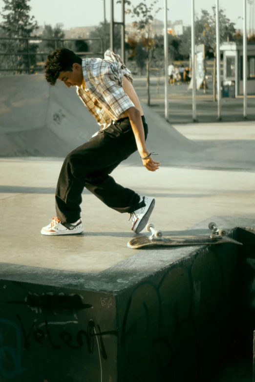 a boy on a skateboard performs a trick