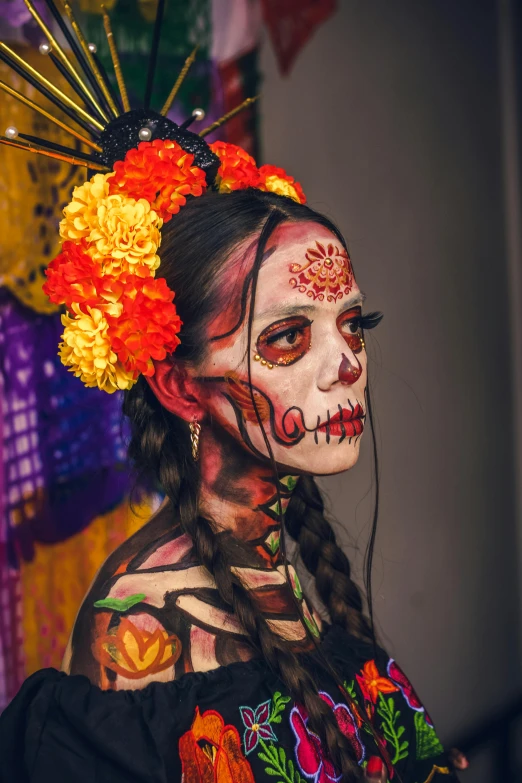 a woman with makeup decorated with a flower