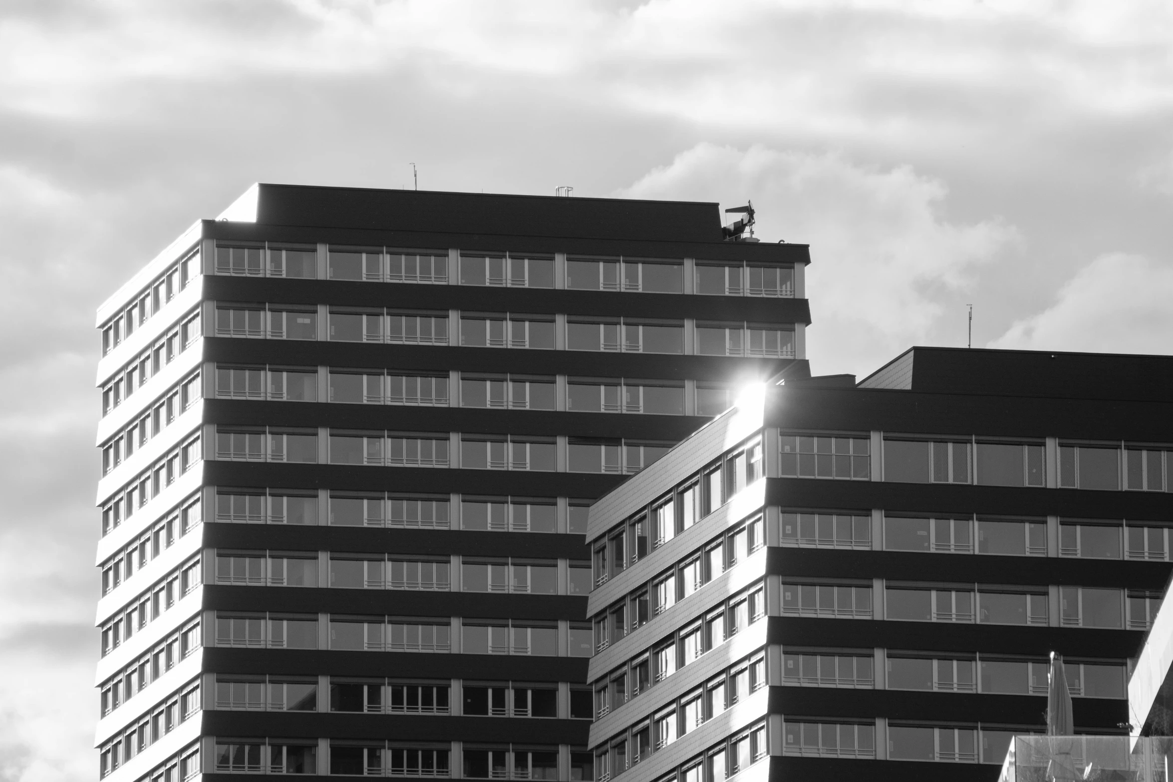 two building next to each other with a sky background