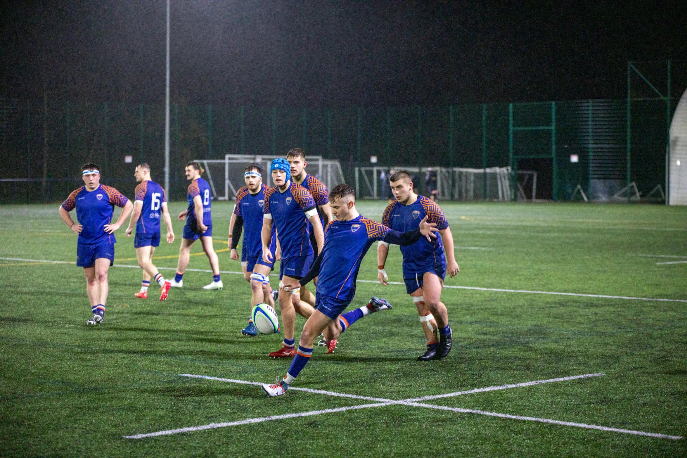 a group of young people playing a game of soccer