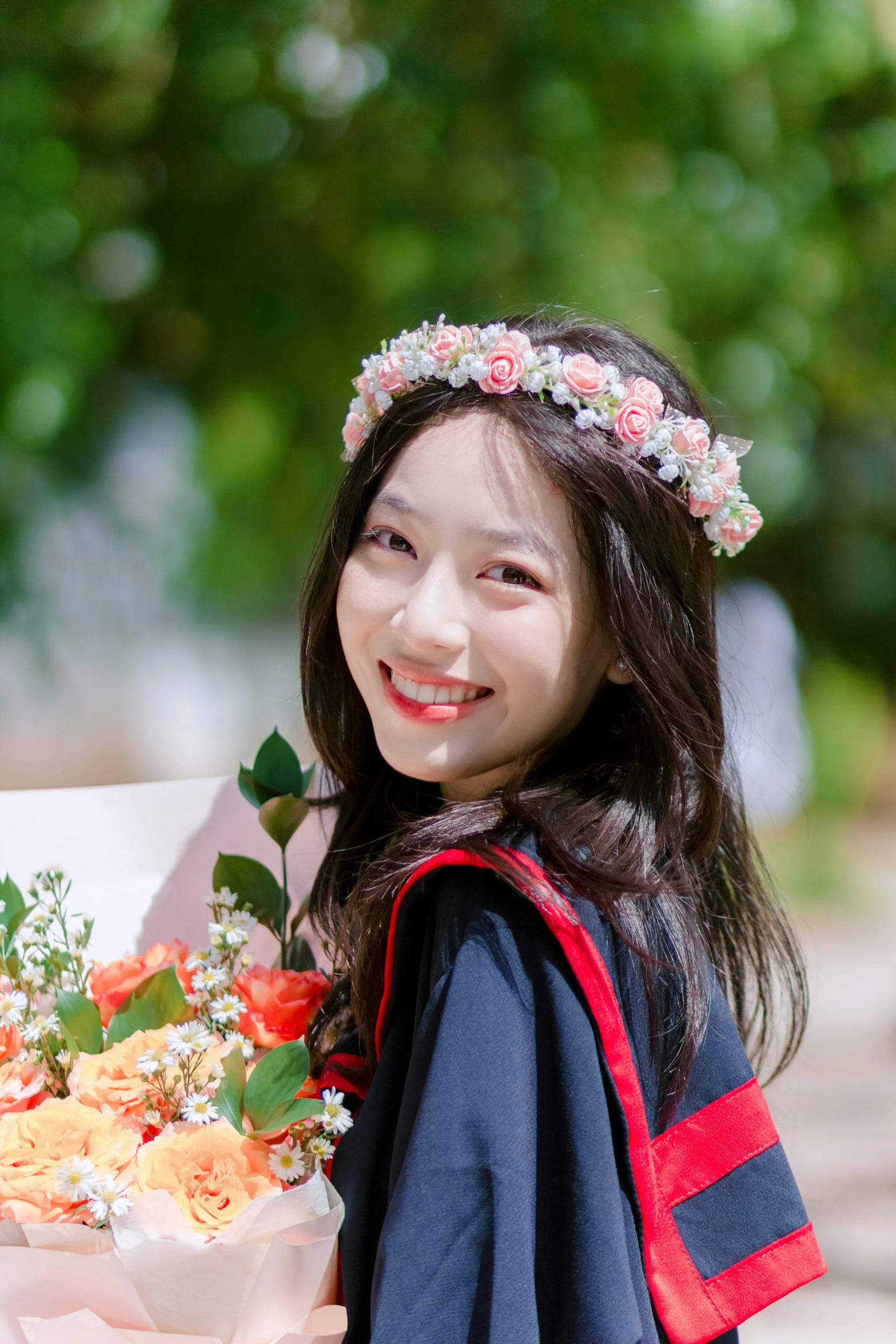 a pretty little girl holding a bunch of flowers