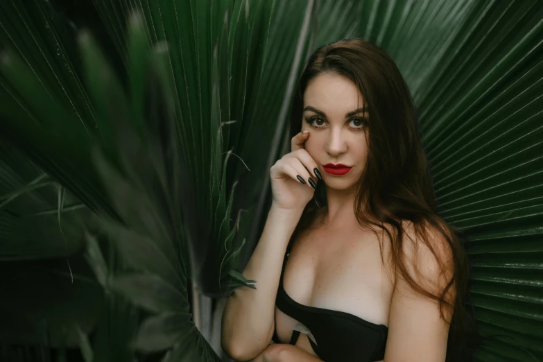 a beautiful young lady in a bikini posing for the camera