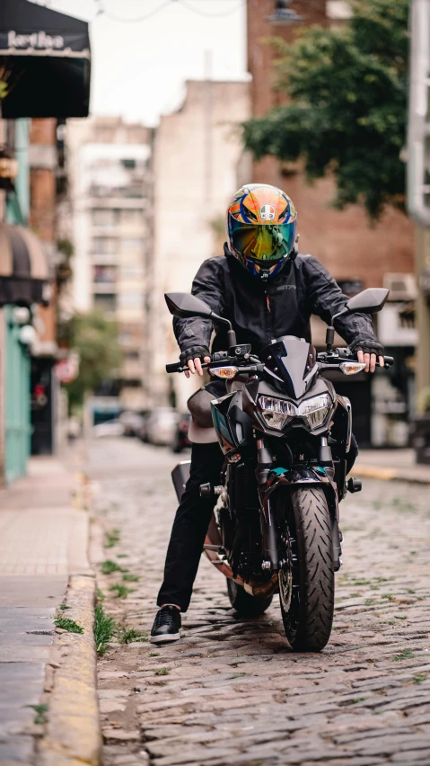 a person is sitting on the back of a motorcycle