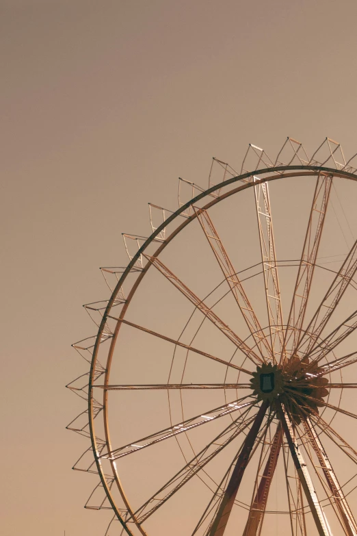 a giant wheel that is sitting up against the sky