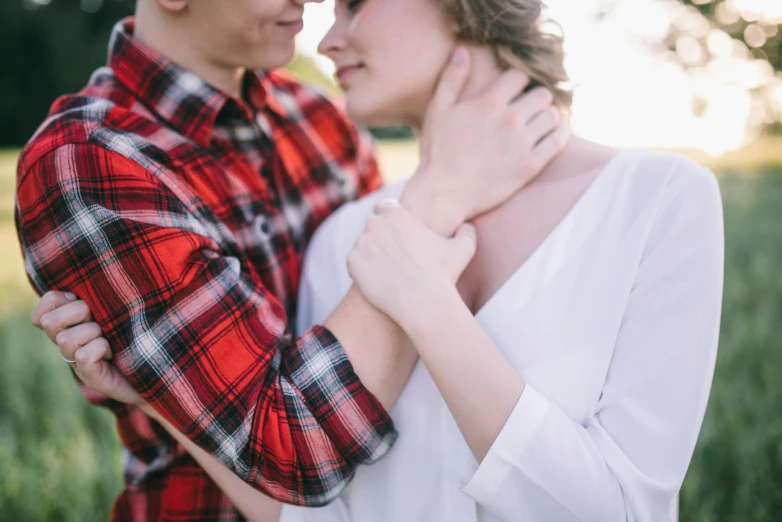 the man and woman are posing for a po