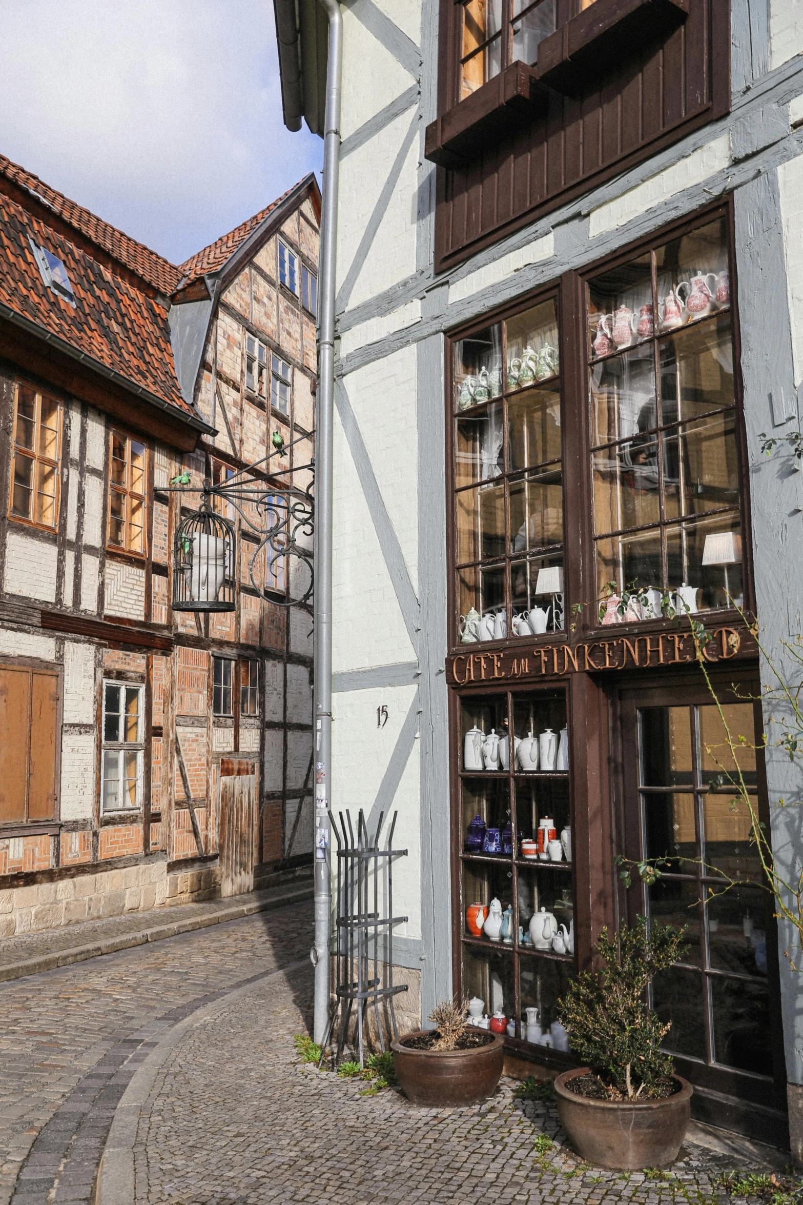 a building with an outside potted plant in front of it