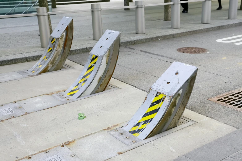 a group of skateboards sit up against the ground