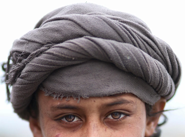 a close up of a person with a tie on