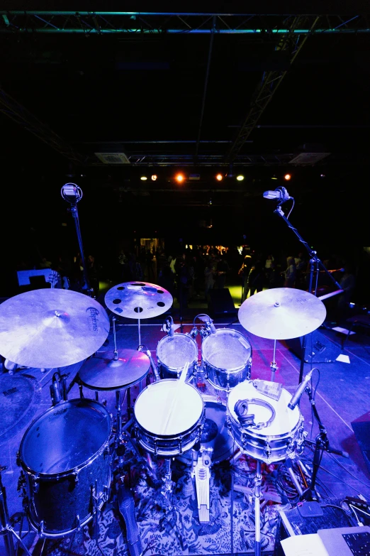 a po of the interior of an arena and two large, portable drums