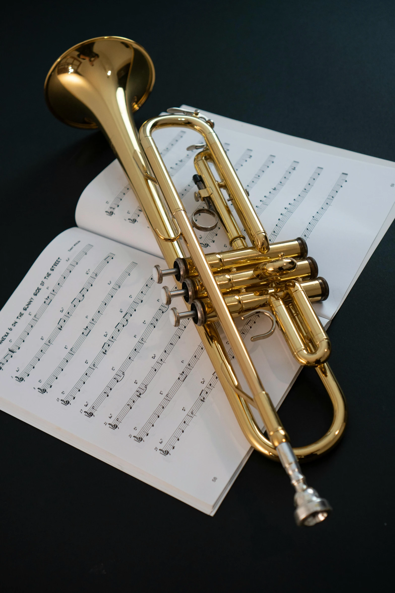 an instrument on a sheet music lying on a table