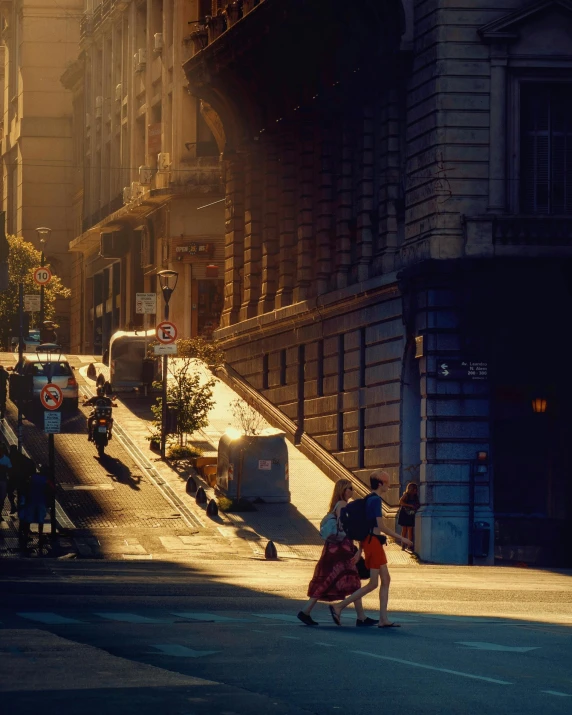 two people are skateboarding down the street with a woman