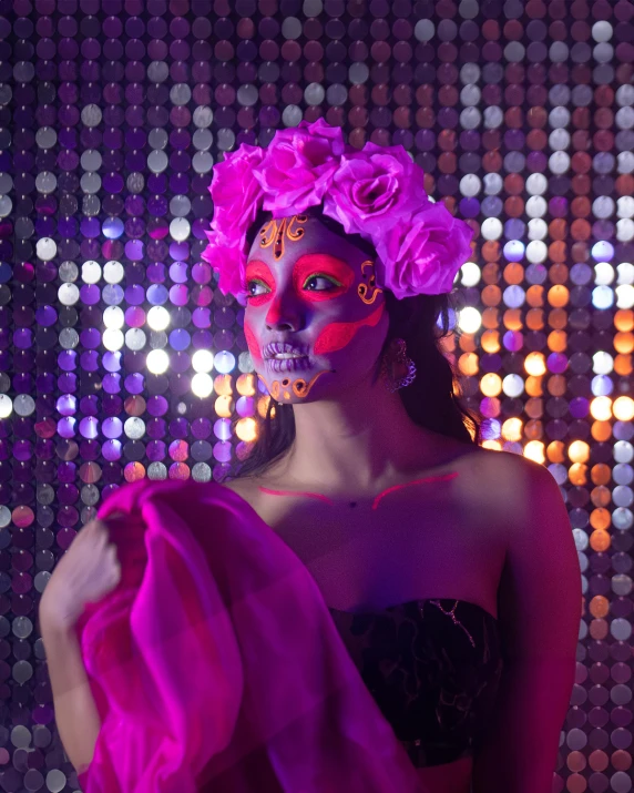 a woman with body painted and purple makeup