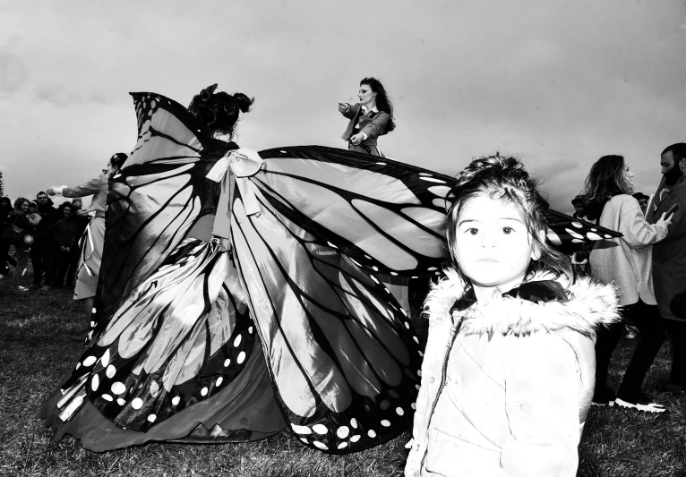 children gather for a costume contest in a field